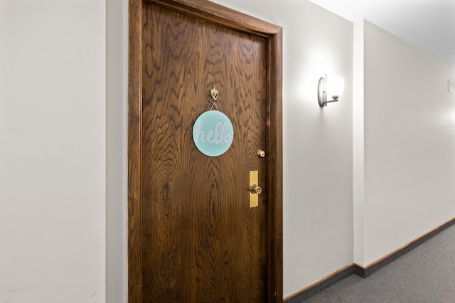 detailed view of carpet flooring and baseboards