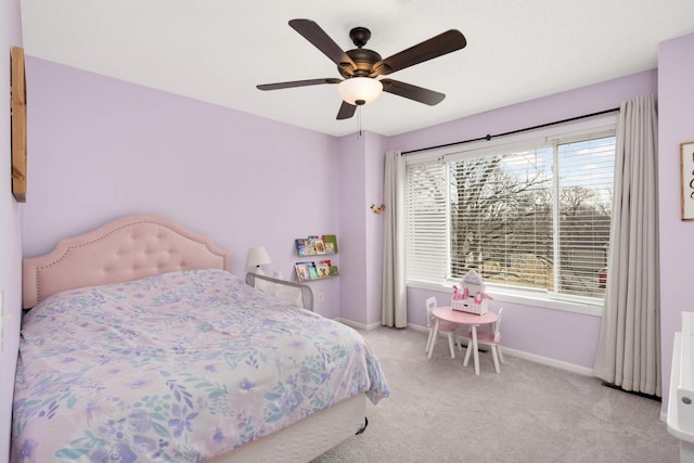 bedroom with carpet floors, ceiling fan, multiple windows, and baseboards