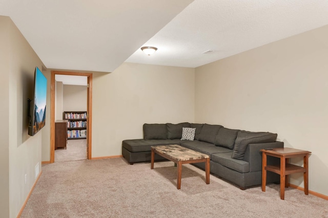 living room featuring carpet floors and baseboards