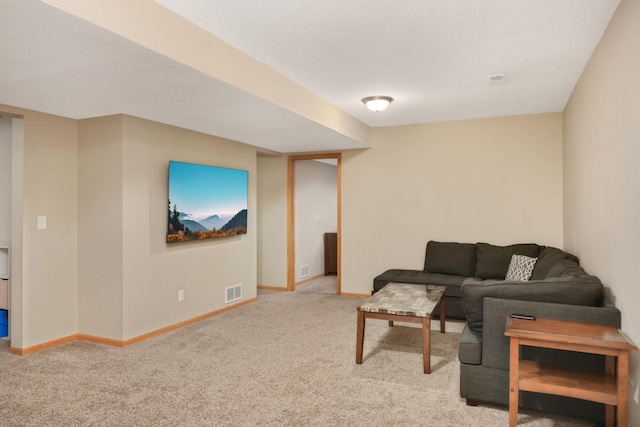 living area with carpet flooring, visible vents, and baseboards