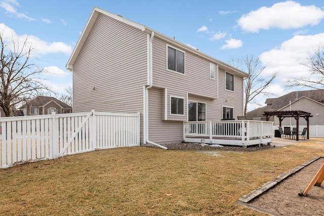 back of house featuring a deck, a patio, a fenced backyard, a yard, and a pergola