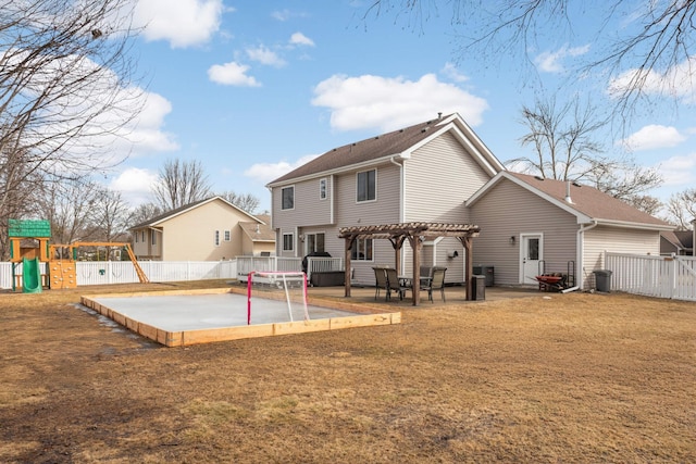 rear view of house with a patio, a playground, a fenced backyard, a lawn, and a pergola