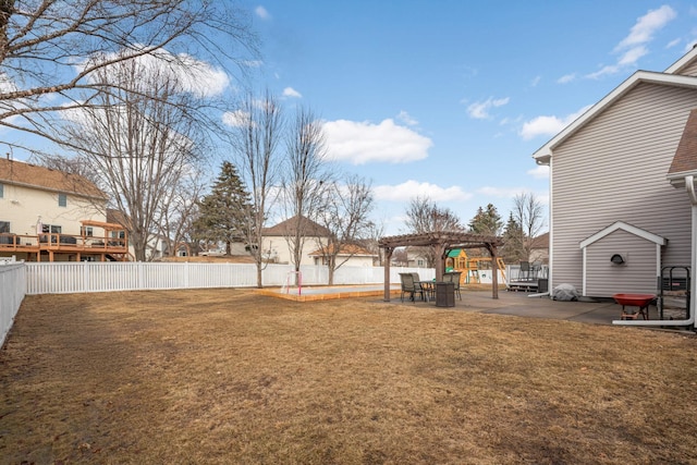 view of yard featuring a patio, a fenced backyard, and a pergola