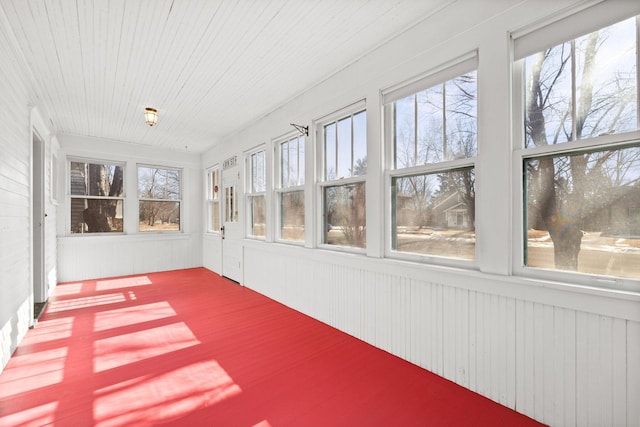 unfurnished sunroom featuring wooden ceiling