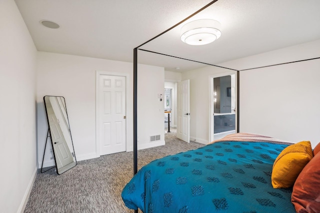 carpeted bedroom featuring visible vents and baseboards