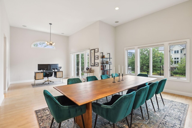 dining room featuring a chandelier, recessed lighting, light wood-style flooring, and baseboards