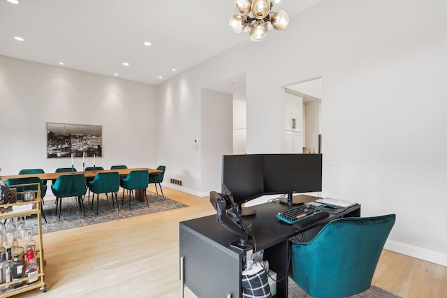 home office featuring recessed lighting, a notable chandelier, light wood-style flooring, and baseboards