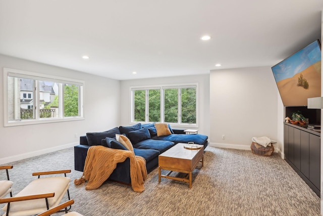 living room featuring carpet, baseboards, and recessed lighting