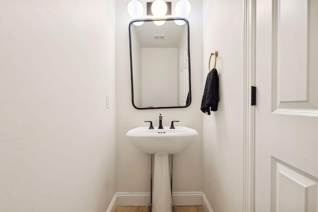 bathroom featuring baseboards