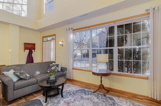 living room with wood finished floors and visible vents