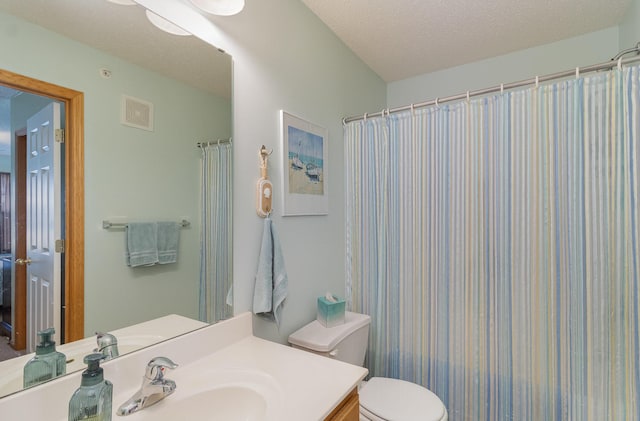 full bath with toilet, visible vents, a textured ceiling, and vanity