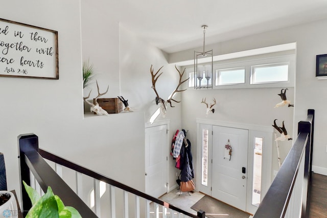 foyer with an inviting chandelier