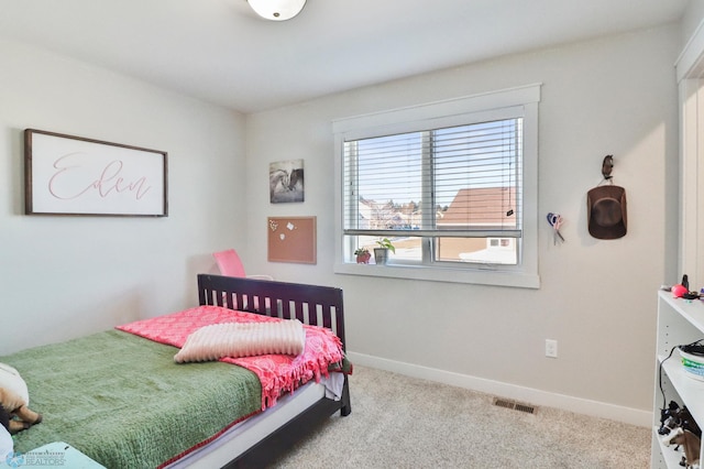 bedroom featuring carpet flooring, visible vents, and baseboards