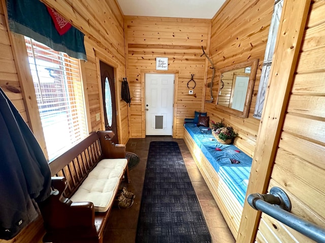 mudroom with wooden walls