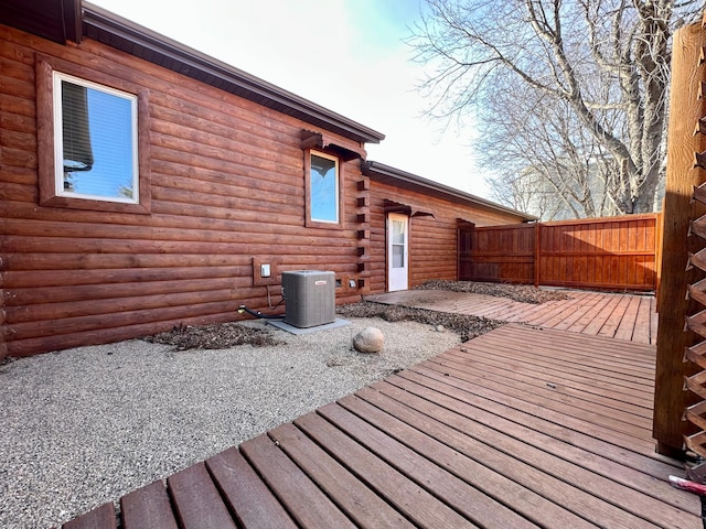 wooden deck with fence, central AC, and a patio