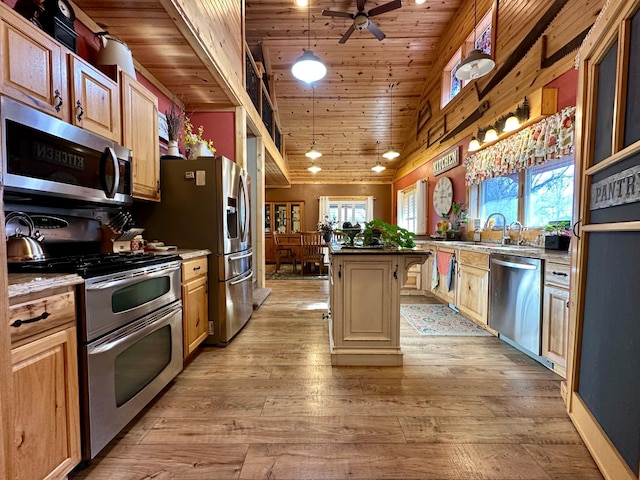 kitchen featuring appliances with stainless steel finishes, wooden ceiling, a sink, and light wood-style floors