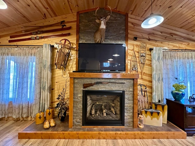 living room with lofted ceiling, wood ceiling, wood walls, and wood finished floors