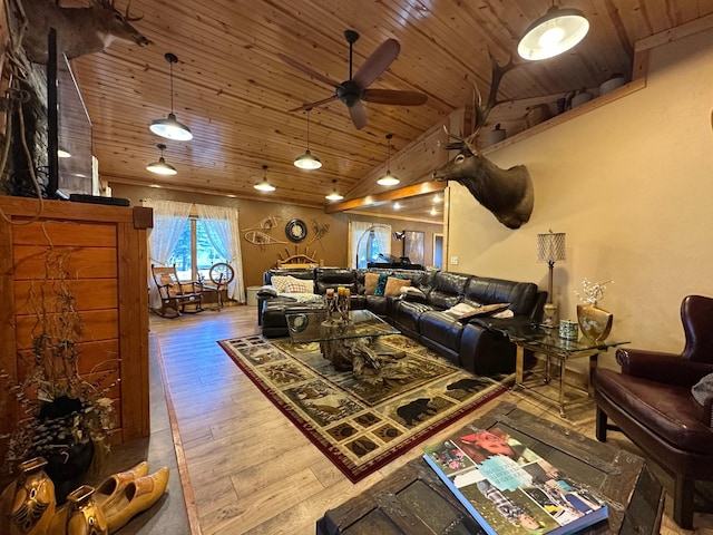 living area with high vaulted ceiling, wooden ceiling, hardwood / wood-style floors, and a ceiling fan