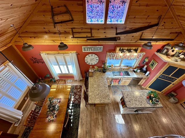 interior space with high vaulted ceiling and wood finished floors