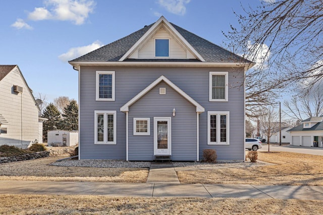 view of front of home featuring roof with shingles