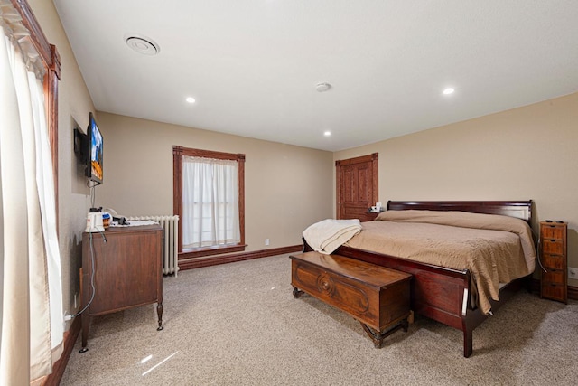 bedroom featuring recessed lighting, radiator heating unit, light carpet, and baseboards