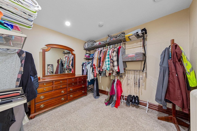 spacious closet with carpet flooring