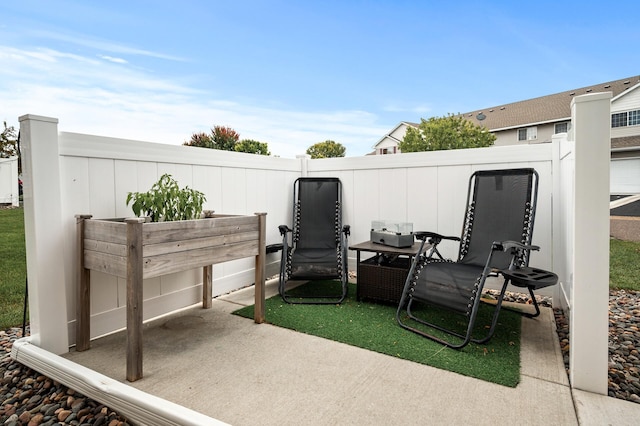 view of patio featuring fence