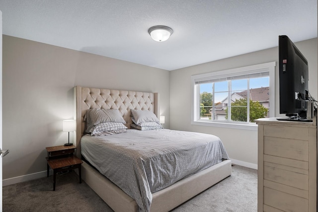 bedroom with carpet and baseboards