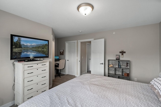 bedroom with carpet and baseboards