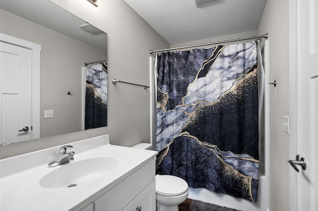 bathroom featuring a shower with shower curtain, a textured ceiling, toilet, and vanity