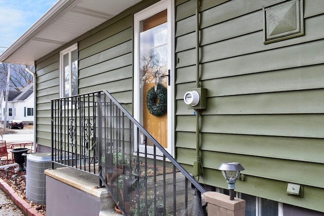 entrance to property featuring central air condition unit