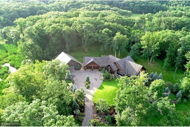 bird's eye view with a forest view