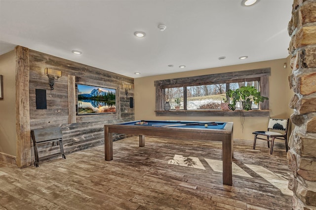 playroom featuring recessed lighting, pool table, an accent wall, wooden walls, and wood finished floors