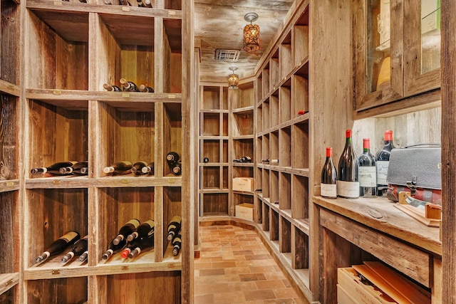 wine room featuring brick floor