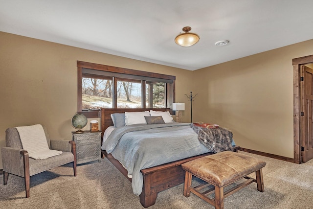 bedroom with carpet and baseboards