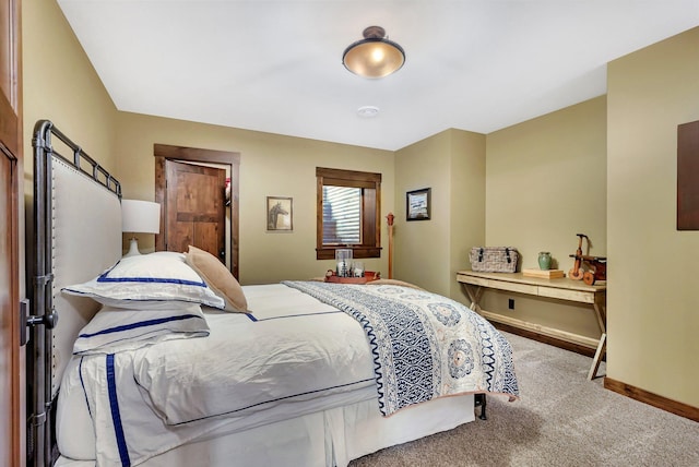 bedroom featuring carpet floors and baseboards