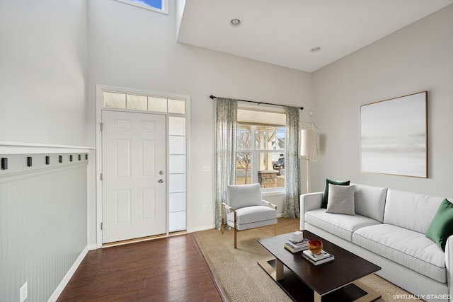 living room with wood finished floors and baseboards