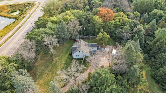 birds eye view of property with a wooded view