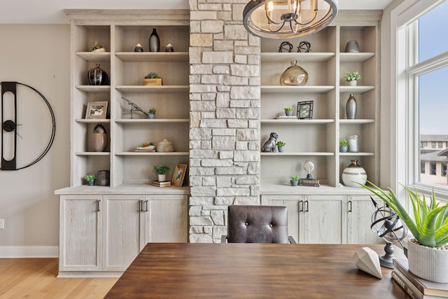 875 Lake St N Unit 402, Wayzata, MN 55391 - office area featuring light wood-style floors, baseboards, and a chandelier