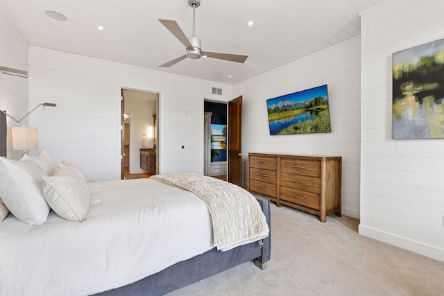 875 Lake St N Unit 402, Wayzata, MN 55391 - bedroom featuring light colored carpet, wooden walls, ensuite bath, recessed lighting, and a ceiling fan