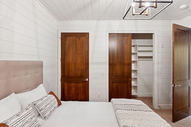 875 Lake St N Unit 402, Wayzata, MN 55391 - bedroom with carpet flooring, a closet, wooden walls, and a walk in closet