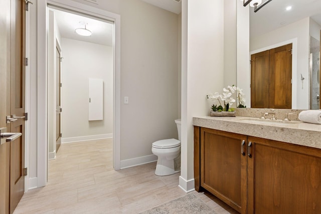 875 Lake St N Unit 402, Wayzata, MN 55391 - full bath featuring baseboards, an enclosed shower, vanity, and toilet