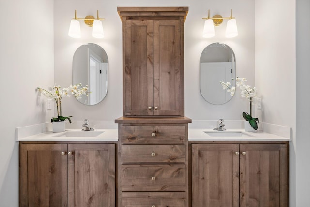 bathroom featuring two vanities and a sink