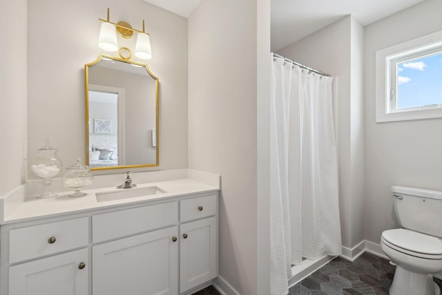 bathroom featuring a shower with shower curtain, vanity, toilet, and baseboards