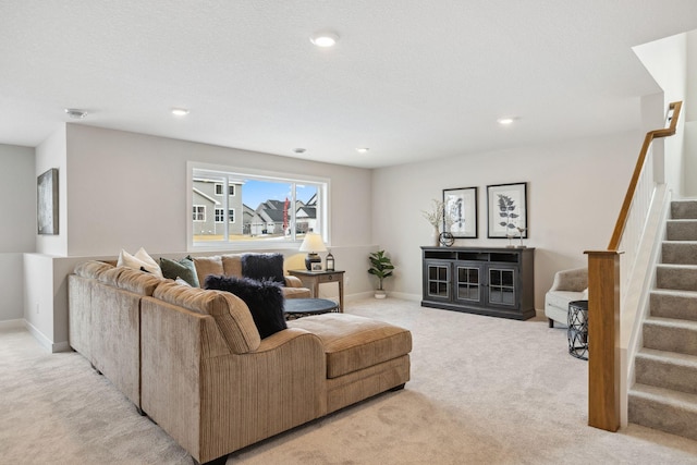 living area featuring stairs, recessed lighting, baseboards, and light colored carpet