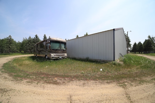 exterior space with an outbuilding and an outdoor structure