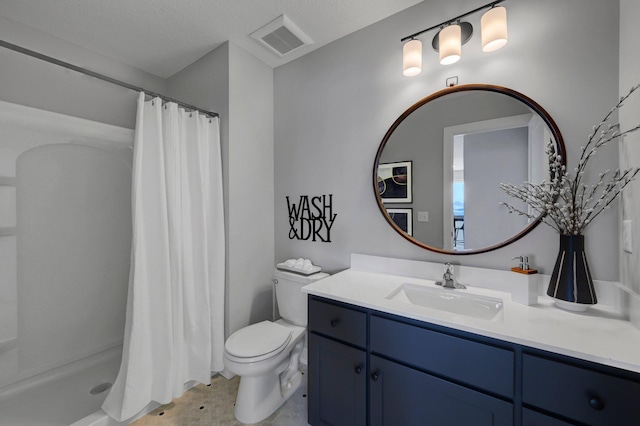 full bath with toilet, vanity, visible vents, and a shower stall