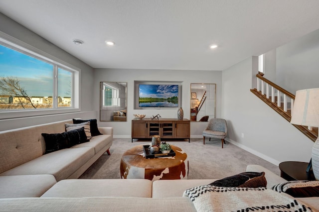 living area featuring stairs, recessed lighting, light carpet, and baseboards