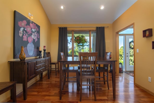 dining space with lofted ceiling, baseboards, wood finished floors, and recessed lighting