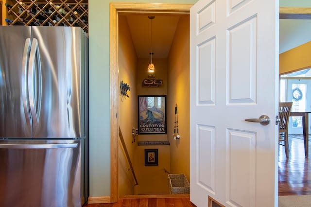 interior space featuring freestanding refrigerator and wood finished floors